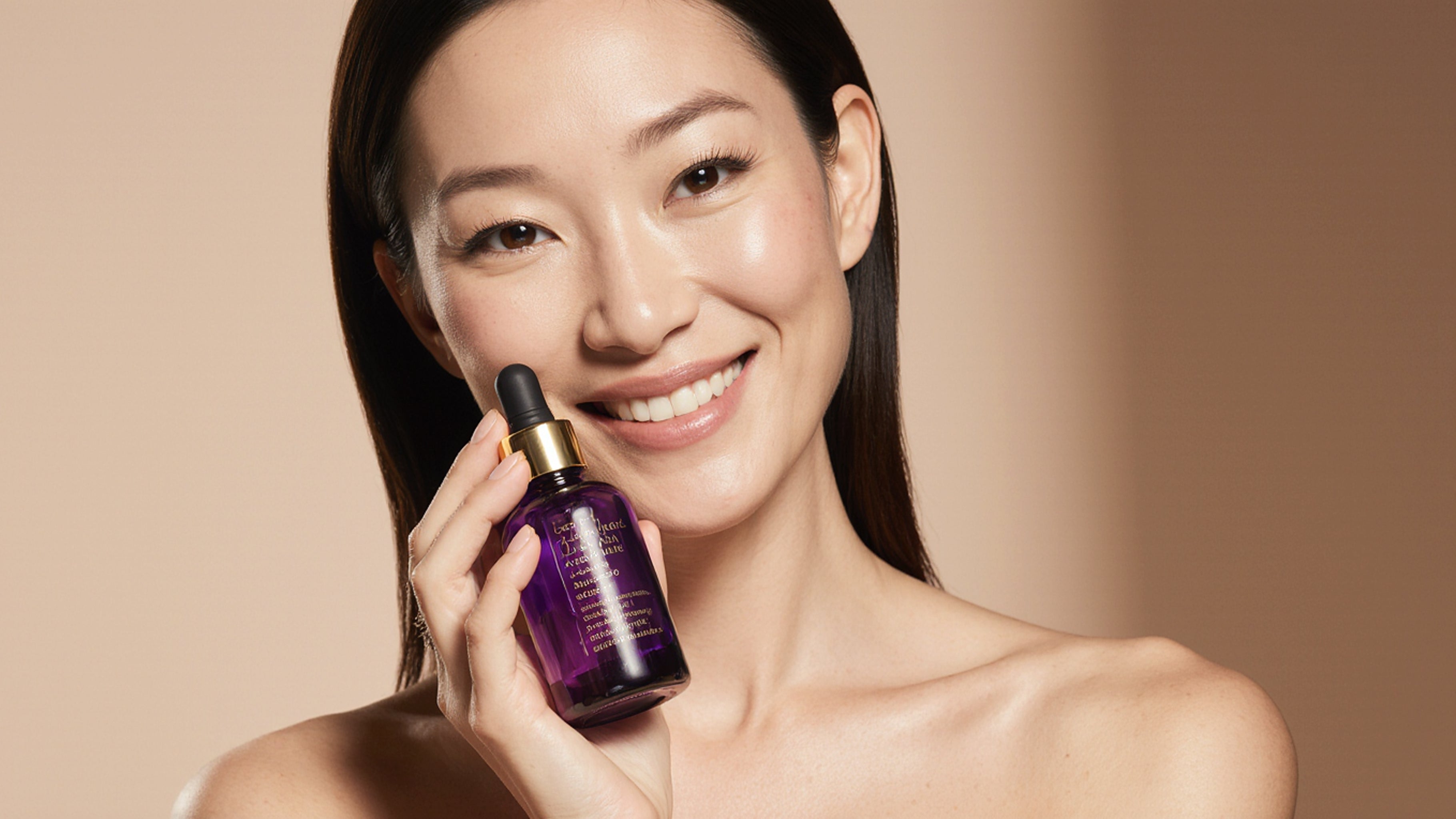 Woman holding a purple skincare dropper bottle against a beige background